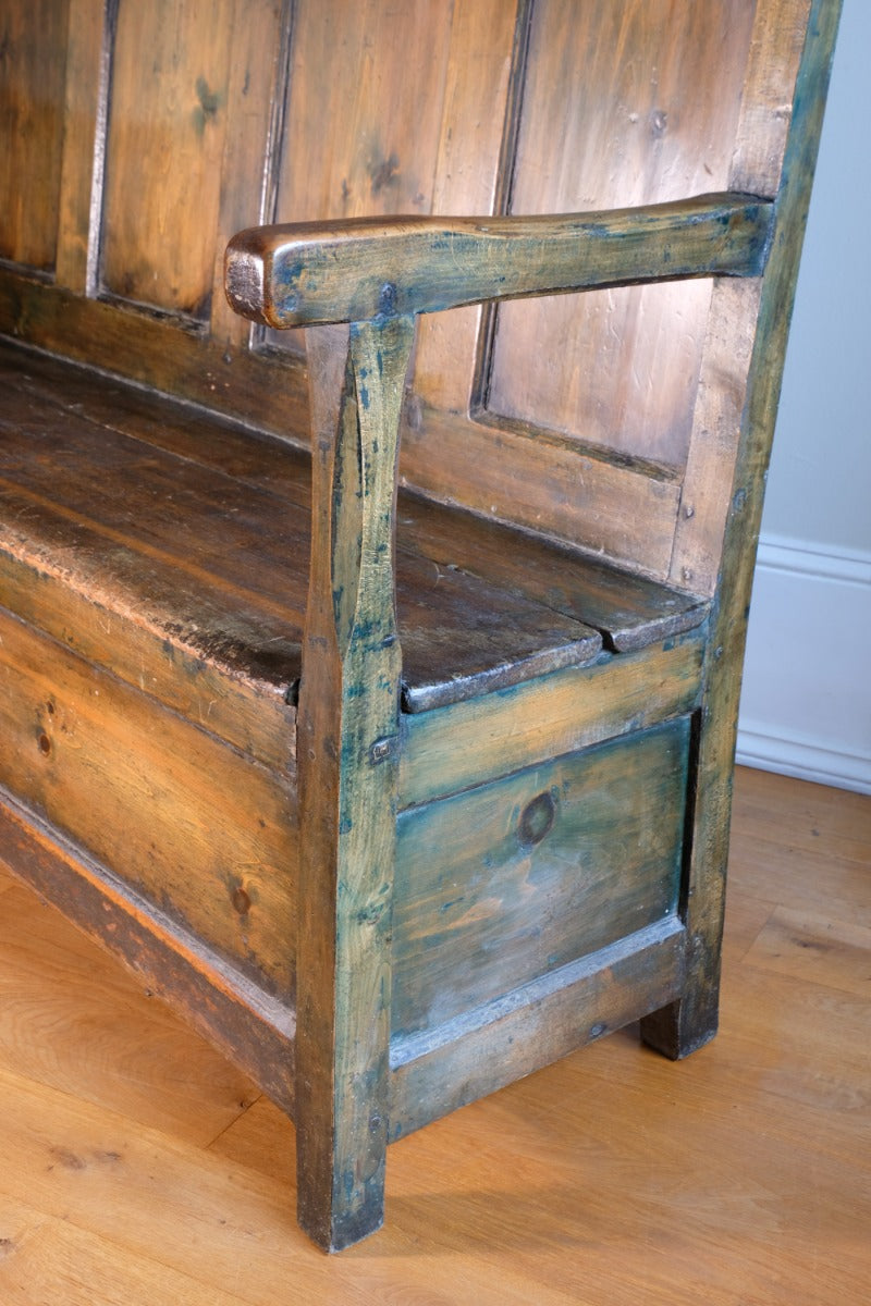 19th century Welsh oak panelled hall settle with storage and green painted finish