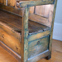 19th century Welsh oak panelled hall settle with storage and green painted finish