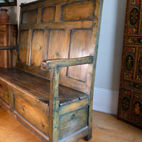 19th century Welsh oak panelled hall settle with storage and green painted finish