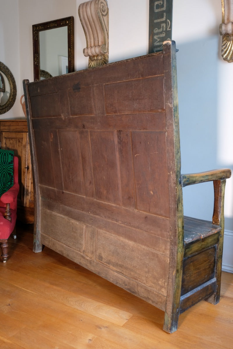 19th century Welsh oak panelled hall settle with storage and green painted finish