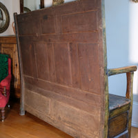 19th century Welsh oak panelled hall settle with storage and green painted finish