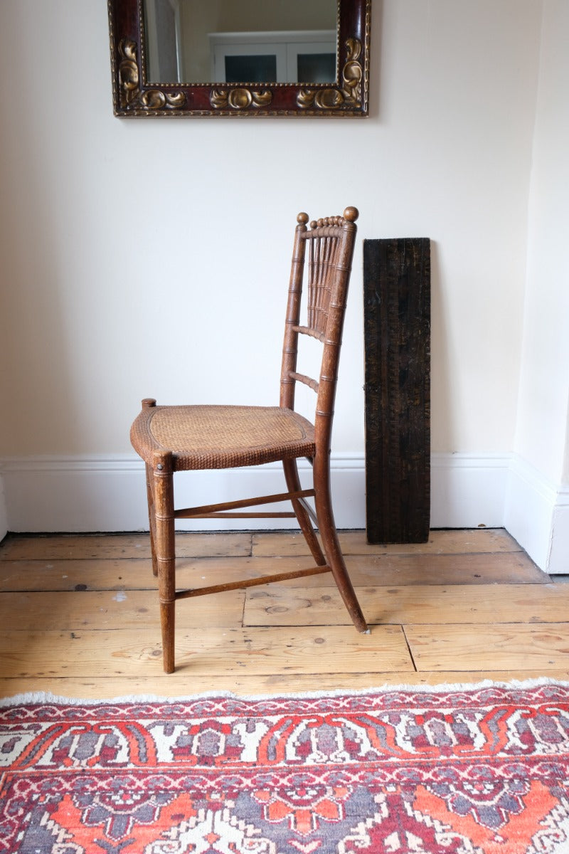Regency faux bamboo painted chair with rattan seat and sunburst back, circa 1820