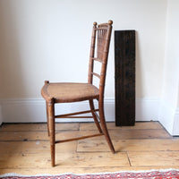 Regency faux bamboo painted chair with rattan seat and sunburst back, circa 1820
