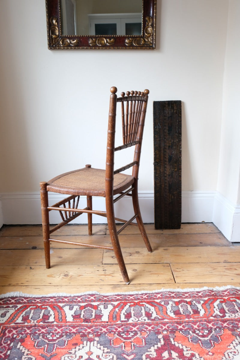 Regency faux bamboo painted chair with rattan seat and sunburst back, circa 1820