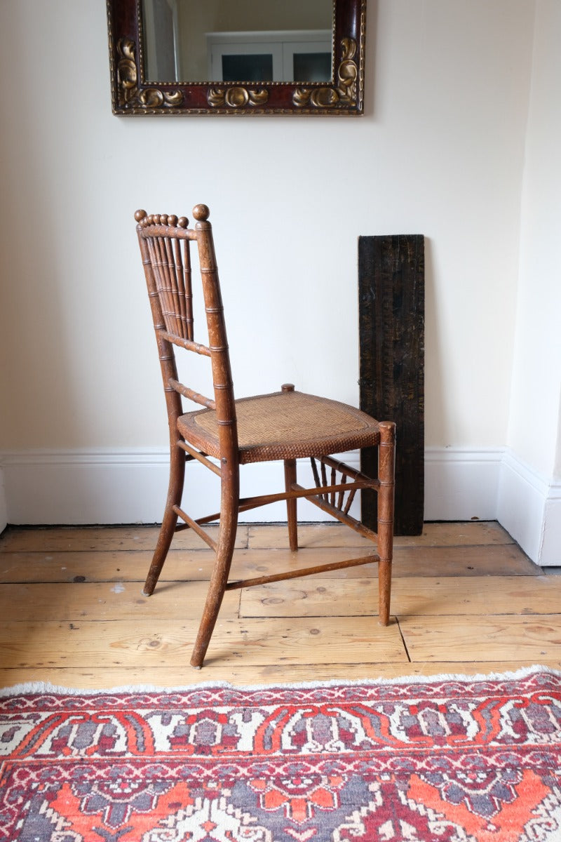 Regency faux bamboo painted chair with rattan seat and sunburst back, circa 1820