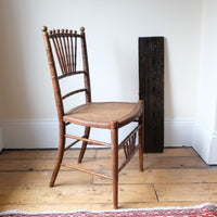 Regency faux bamboo painted chair with rattan seat and sunburst back, circa 1820