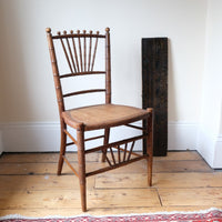 Regency faux bamboo painted chair with rattan seat and sunburst back, circa 1820
