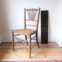Regency faux bamboo painted chair with rattan seat and sunburst back, circa 1820