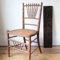 Regency faux bamboo painted chair with rattan seat and sunburst back, circa 1820
