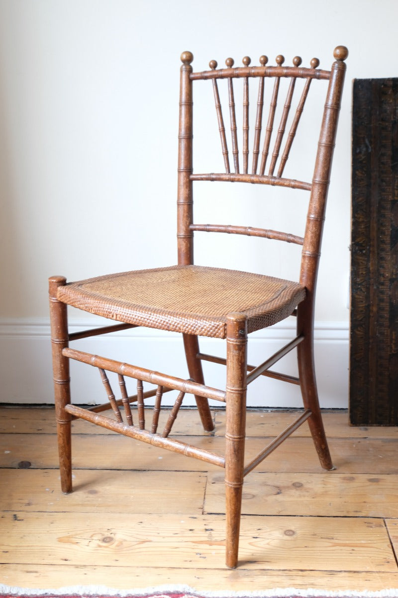Regency faux bamboo painted chair with rattan seat and sunburst back, circa 1820