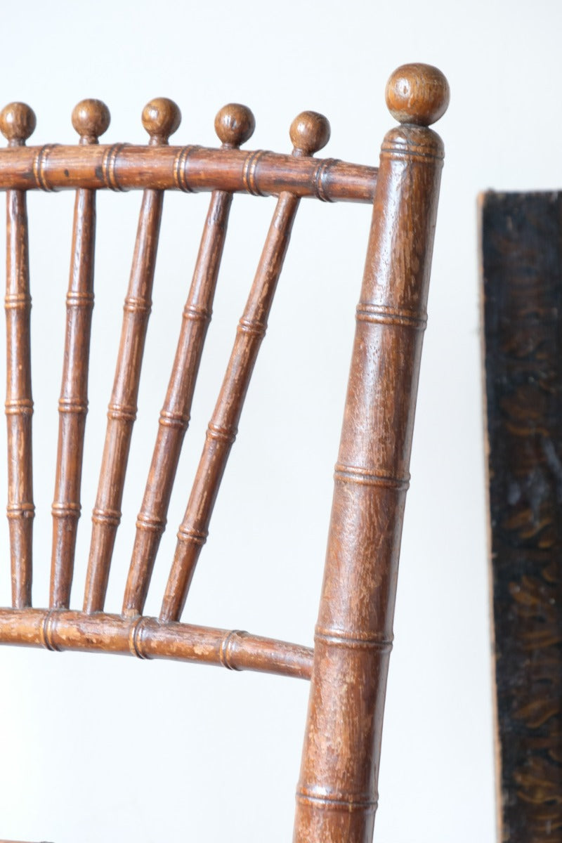 Regency faux bamboo painted chair with rattan seat and sunburst back, circa 1820