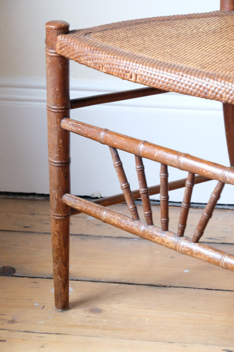 Regency faux bamboo painted chair with rattan seat and sunburst back, circa 1820