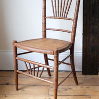Regency faux bamboo painted chair with rattan seat and sunburst back, circa 1820