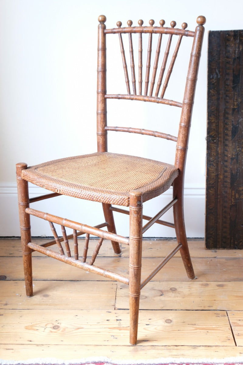 Regency faux bamboo painted chair with rattan seat and sunburst back, circa 1820