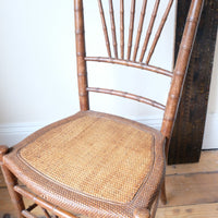 Regency faux bamboo painted chair with rattan seat and sunburst back, circa 1820