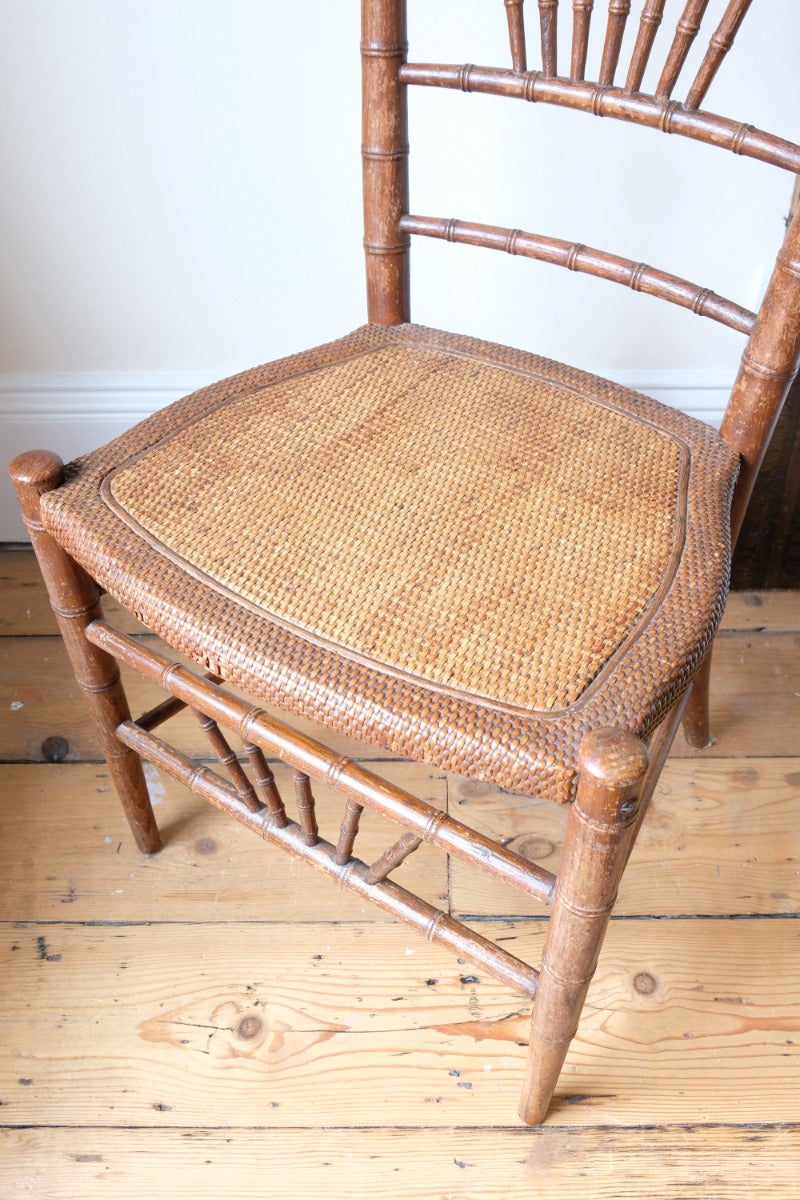 Regency faux bamboo painted chair with rattan seat and sunburst back, circa 1820
