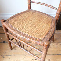 Regency faux bamboo painted chair with rattan seat and sunburst back, circa 1820