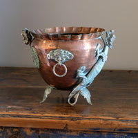Side detail of brass dragon motif on Tibetan copper planter