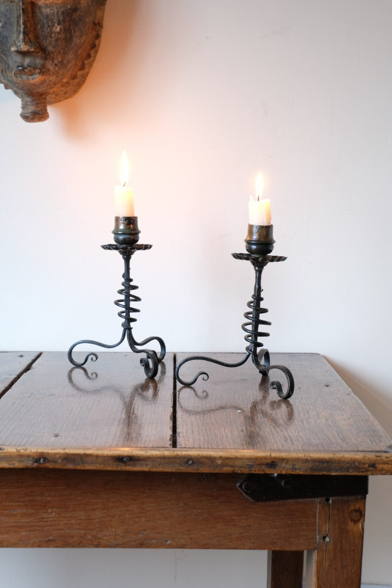 Arts & Crafts wrought iron candlesticks with copper drip trays