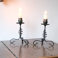Arts & Crafts wrought iron candlesticks with copper drip trays