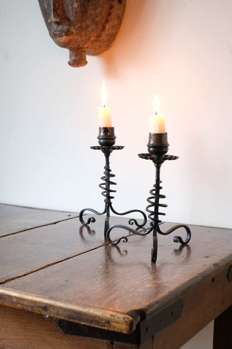 Arts & Crafts wrought iron candlesticks with copper drip trays