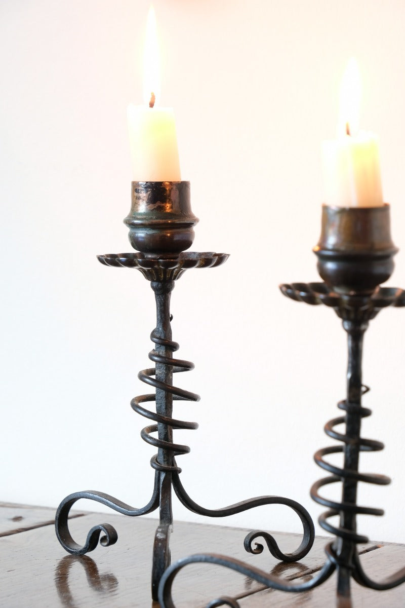 Arts & Crafts wrought iron candlesticks with copper drip trays