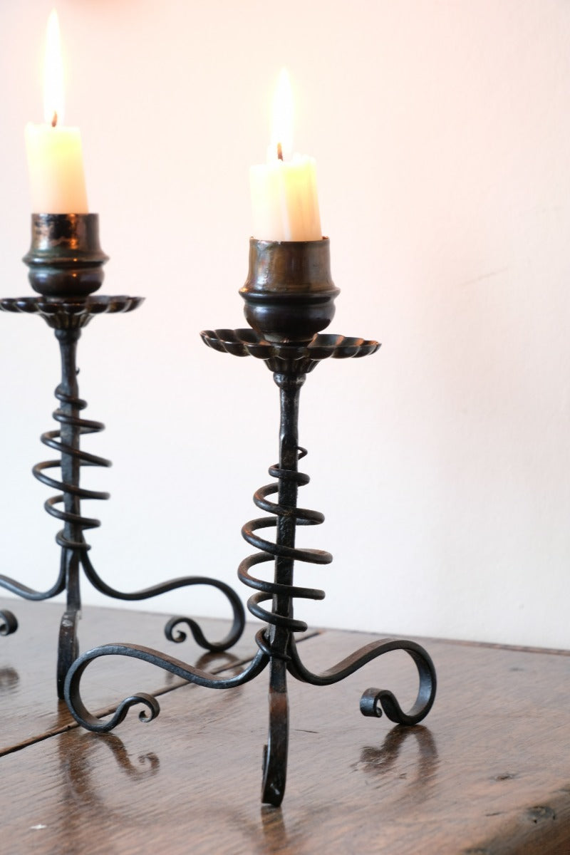 Arts & Crafts wrought iron candlesticks with copper drip trays