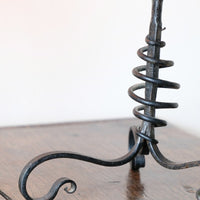 Pair of hand-forged Arts & Crafts wrought iron and copper candlesticks with spiral stems and floral drip trays