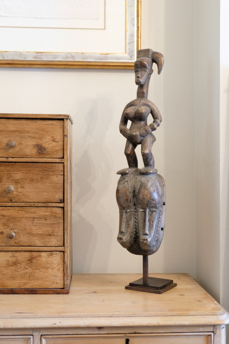 Guro fertility figure sculpture on stand Côte d’Ivoire hand‑carved wood