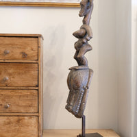 Guro fertility figure sculpture on stand Côte d’Ivoire hand‑carved wood