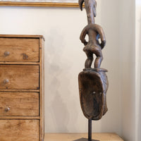Guro fertility figure sculpture on stand Côte d’Ivoire hand‑carved wood