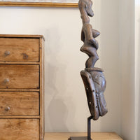 Guro fertility figure sculpture on stand Côte d’Ivoire hand‑carved wood