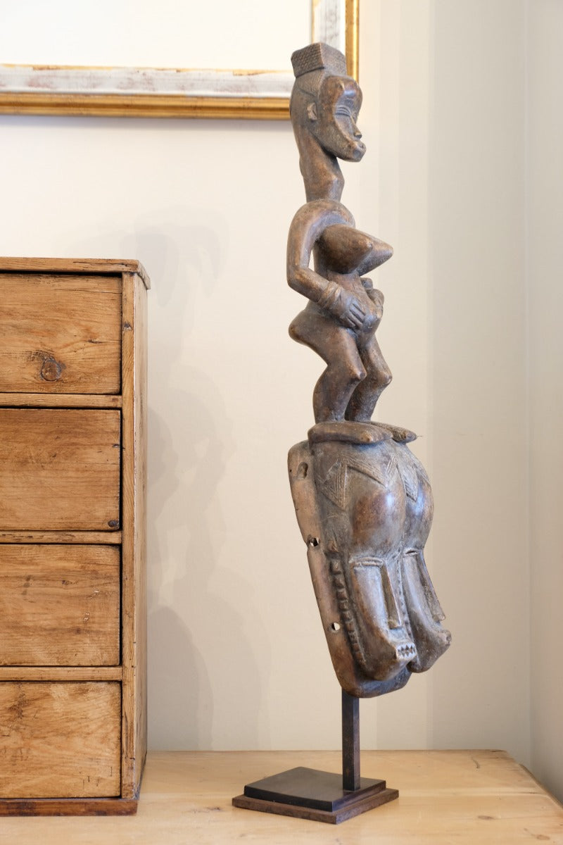 Guro fertility figure sculpture on stand Côte d’Ivoire hand‑carved wood