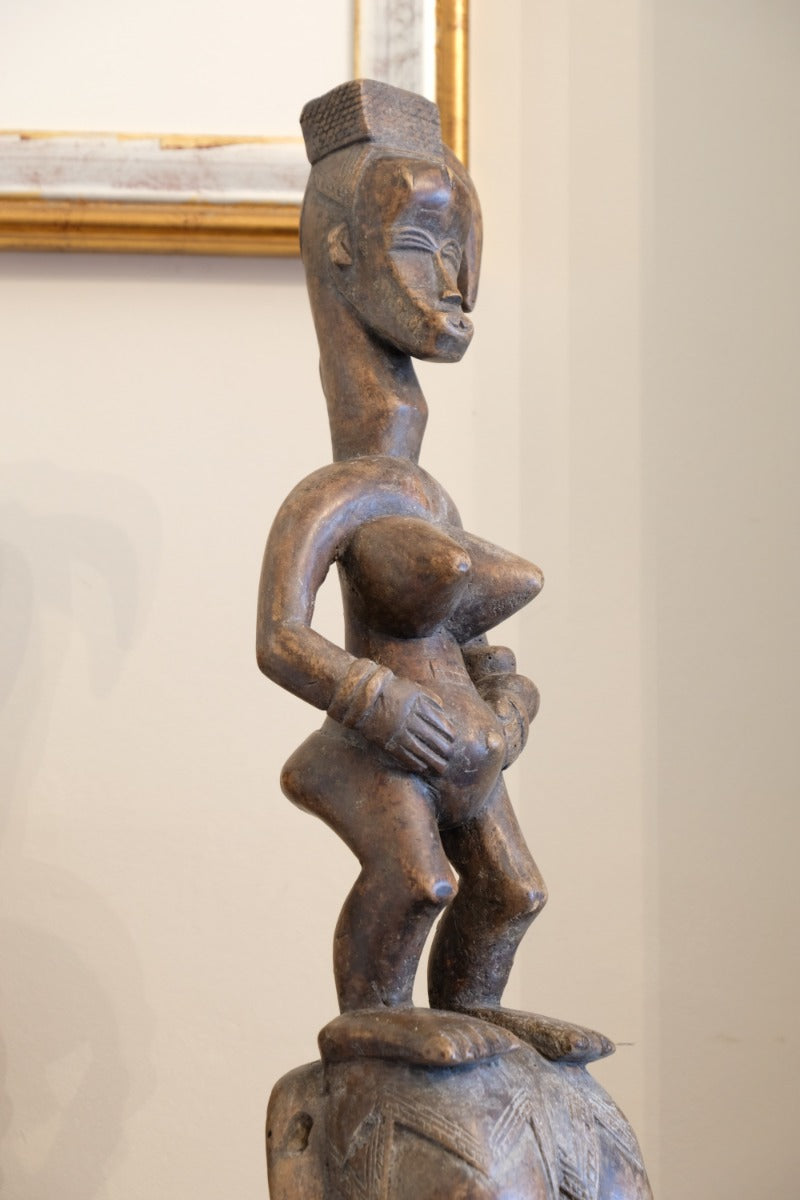 Guro fertility figure sculpture on stand Côte d’Ivoire hand‑carved wood