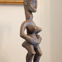 Guro fertility figure sculpture on stand Côte d’Ivoire hand‑carved wood