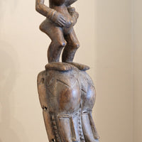 Guro fertility figure sculpture on stand Côte d’Ivoire hand‑carved wood