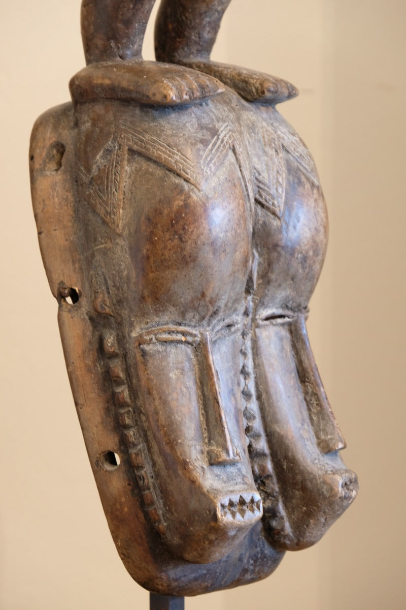 Guro fertility figure sculpture on stand Côte d’Ivoire hand‑carved wood