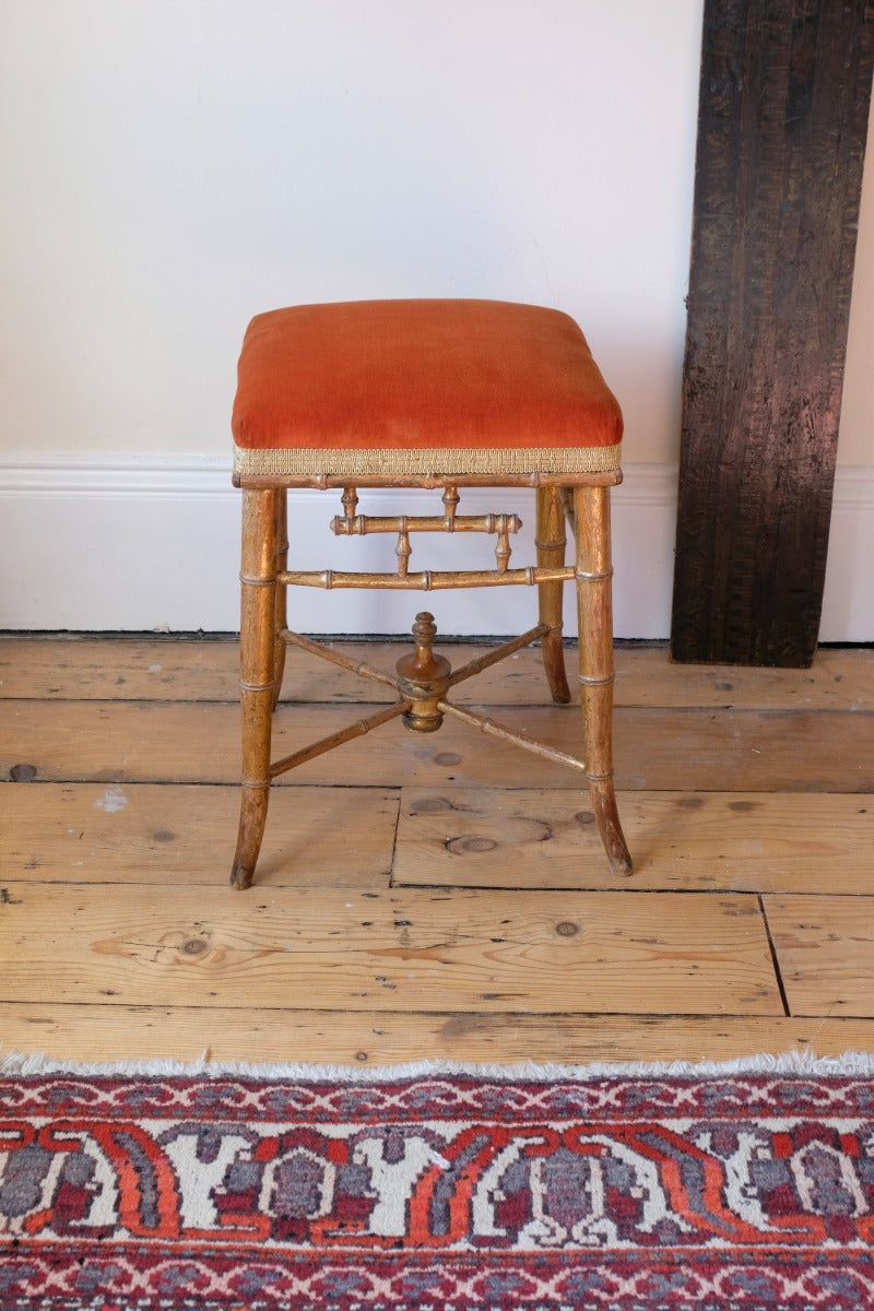 Regency giltwood faux bamboo music stool with swept out legs