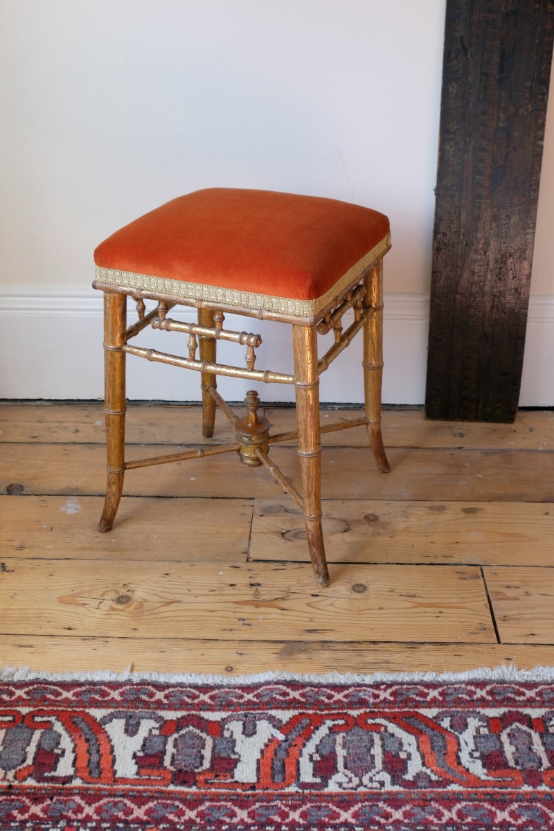 Regency giltwood faux bamboo music stool with swept out legs