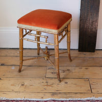 Regency giltwood faux bamboo music stool with swept out legs