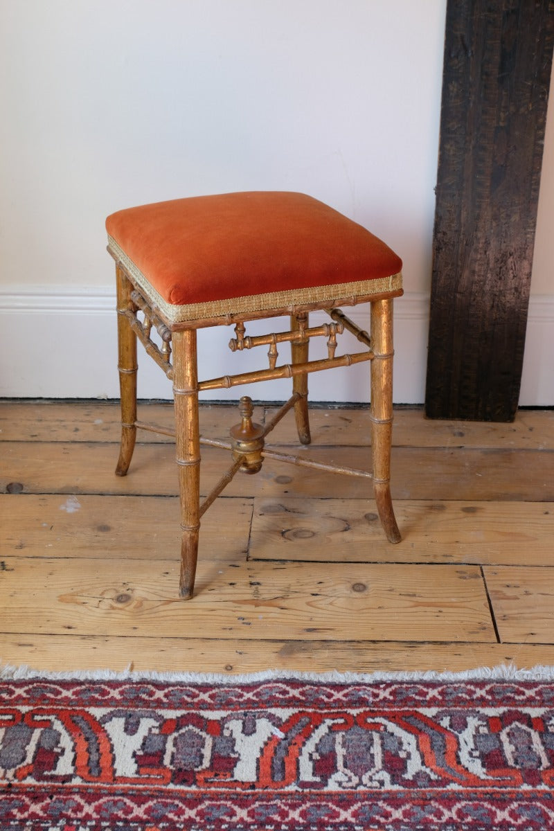 Regency giltwood faux bamboo music stool with swept out legs