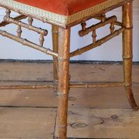 Regency giltwood faux bamboo music stool with swept out legs