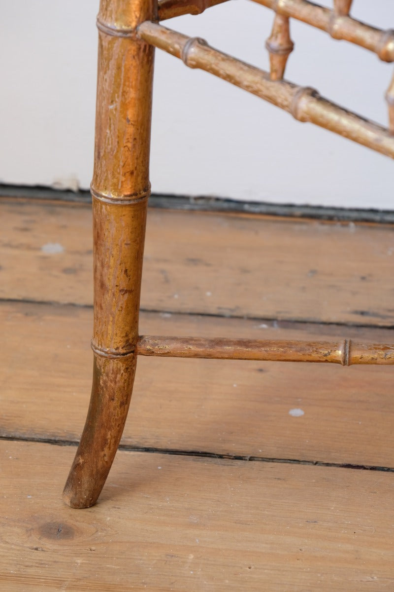 Regency giltwood faux bamboo music stool with swept out legs
