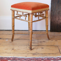 Regency giltwood faux bamboo music stool with swept out legs