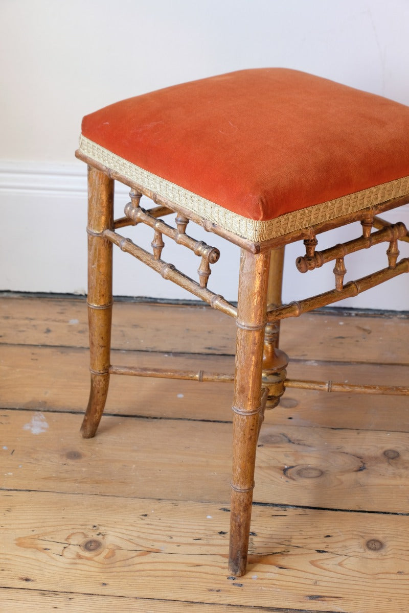 Regency giltwood faux bamboo music stool with swept out legs