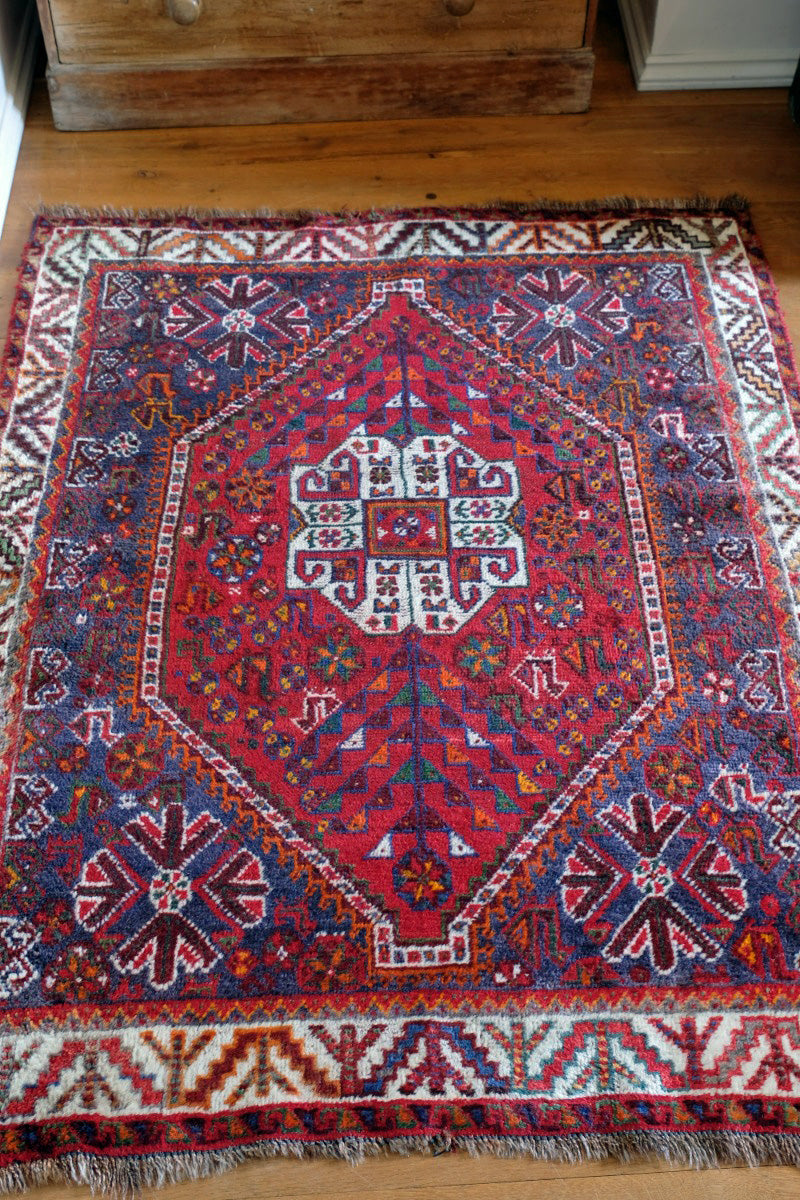 Persian Shiraz rug red ground animal motifs