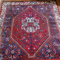 Persian Shiraz Wool Rug – Deep Red Ground with Tribal Motifs