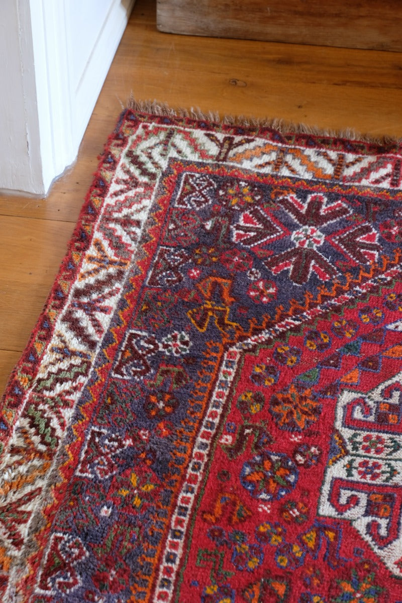 Persian Shiraz rug red ground animal motifs