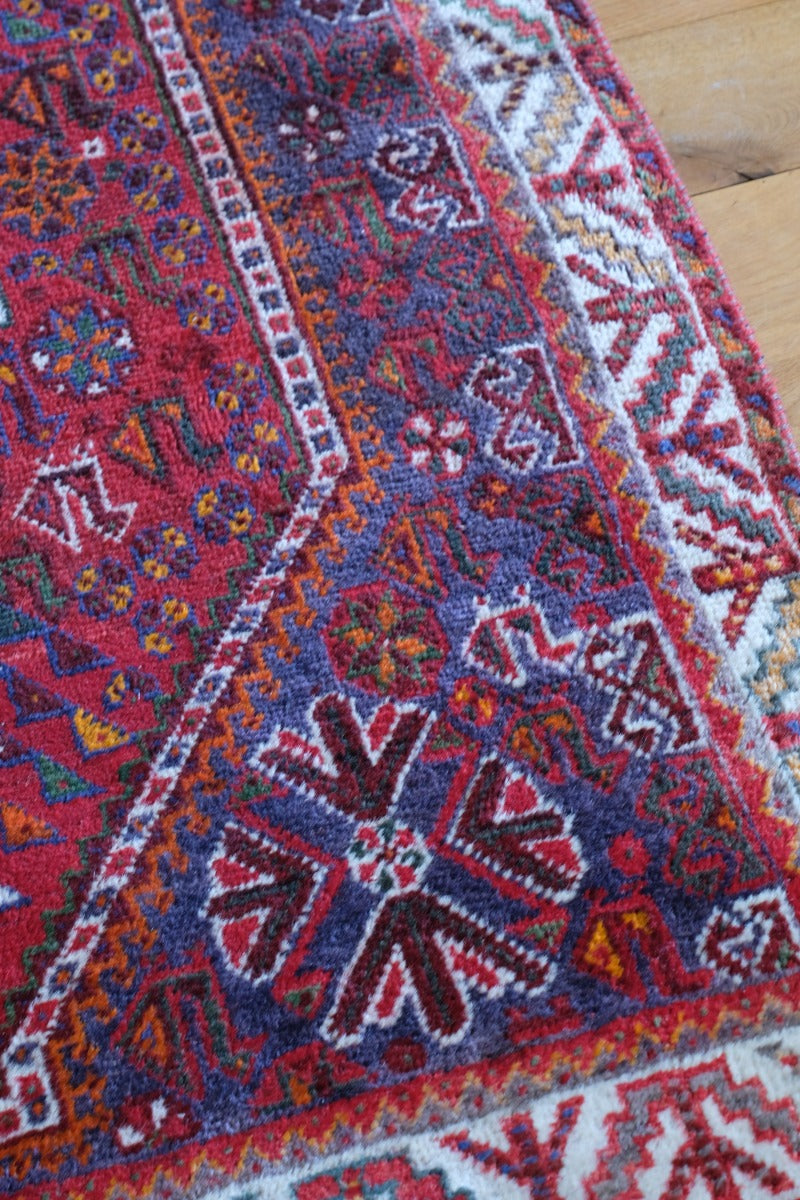 Persian Shiraz rug red ground animal motifs