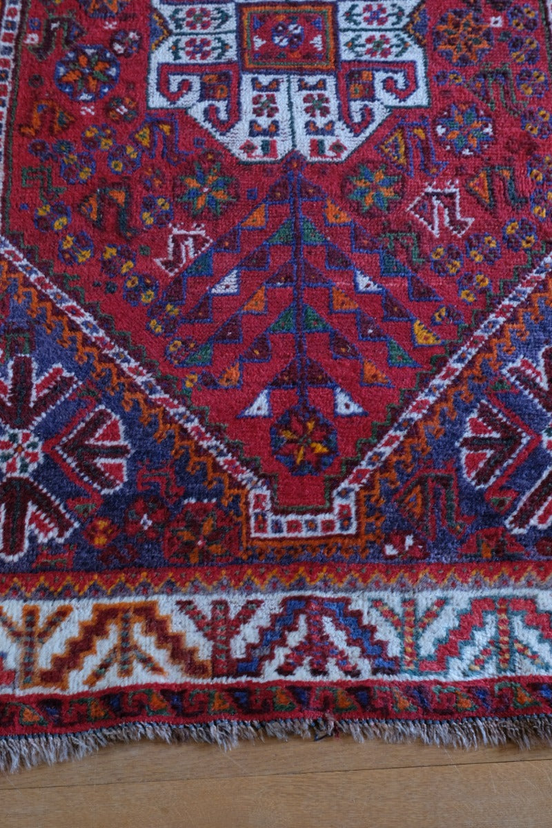 Persian Shiraz rug red ground animal motifs